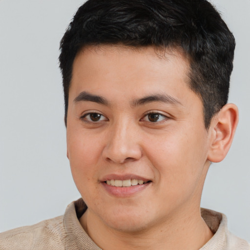 Joyful asian young-adult male with short  brown hair and brown eyes