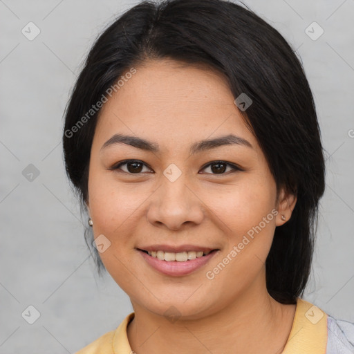 Joyful asian young-adult female with medium  black hair and brown eyes