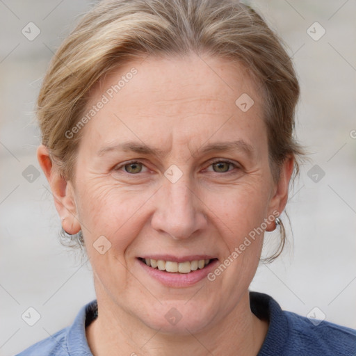 Joyful white adult female with medium  brown hair and blue eyes