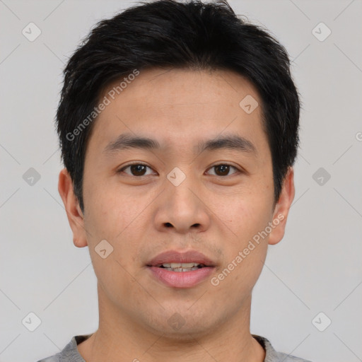 Joyful asian young-adult male with short  black hair and brown eyes