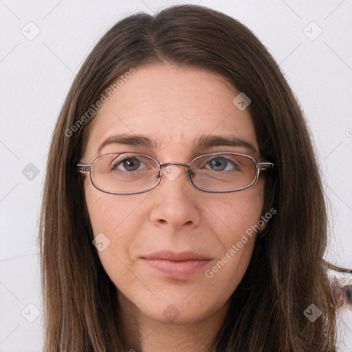 Joyful white adult female with long  brown hair and grey eyes