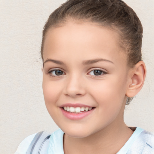 Joyful white child female with short  brown hair and brown eyes