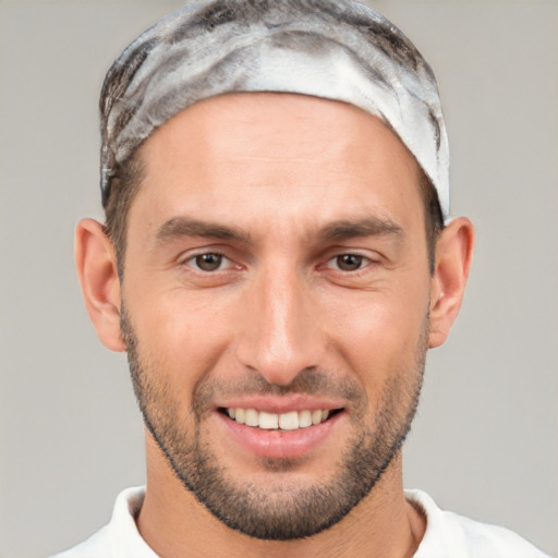 Joyful white young-adult male with short  brown hair and brown eyes