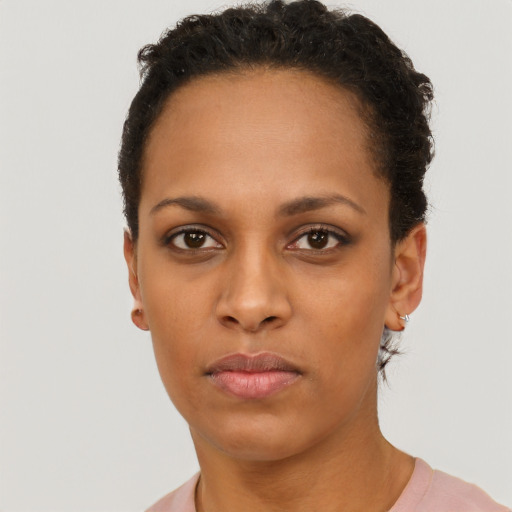 Neutral black young-adult female with short  brown hair and brown eyes