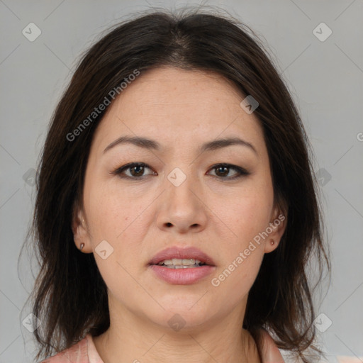 Joyful white adult female with medium  brown hair and brown eyes