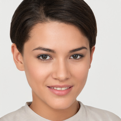 Joyful white young-adult female with short  brown hair and brown eyes