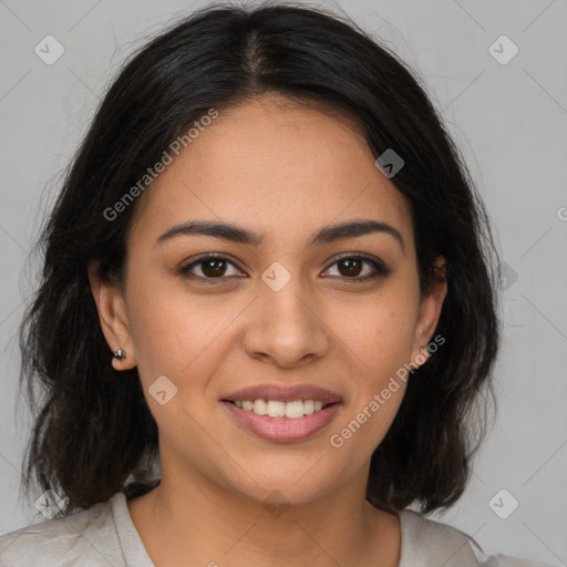 Joyful latino young-adult female with medium  brown hair and brown eyes