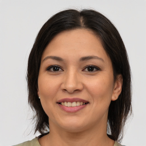 Joyful asian young-adult female with medium  brown hair and brown eyes