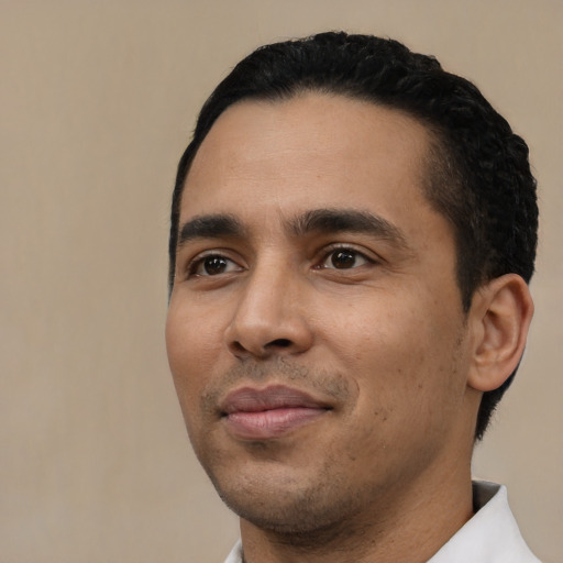 Neutral latino young-adult male with short  black hair and brown eyes