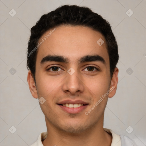 Joyful white young-adult male with short  black hair and brown eyes