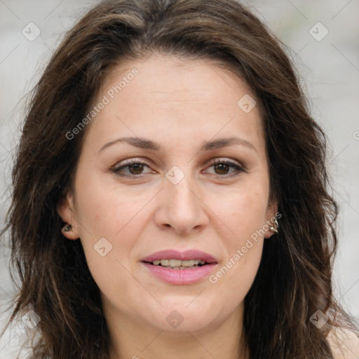 Joyful white adult female with long  brown hair and brown eyes