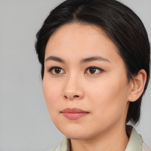 Neutral asian young-adult female with medium  brown hair and brown eyes
