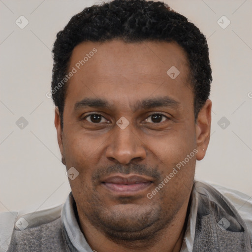 Joyful latino adult male with short  black hair and brown eyes