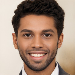 Joyful white young-adult male with short  black hair and brown eyes