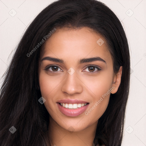 Joyful latino young-adult female with long  brown hair and brown eyes