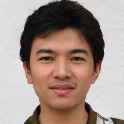 Joyful asian young-adult male with short  black hair and brown eyes