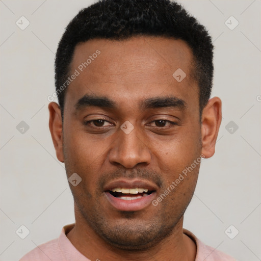 Joyful black young-adult male with short  black hair and brown eyes