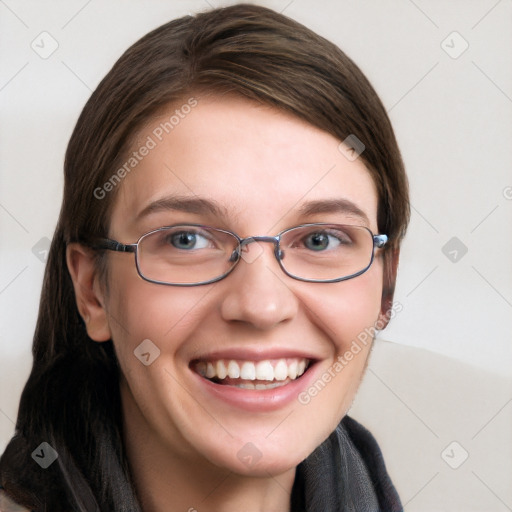 Joyful white young-adult female with long  brown hair and blue eyes