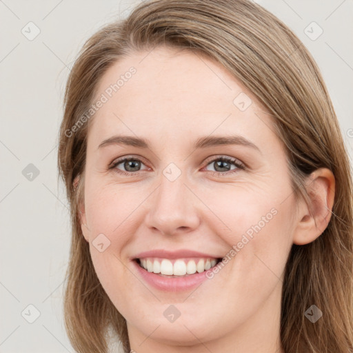 Joyful white young-adult female with long  brown hair and grey eyes