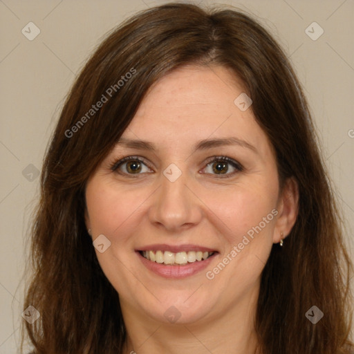 Joyful white adult female with long  brown hair and brown eyes