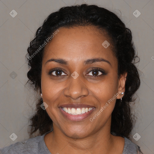 Joyful black young-adult female with medium  black hair and brown eyes