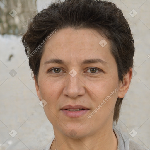 Joyful white adult female with short  brown hair and brown eyes