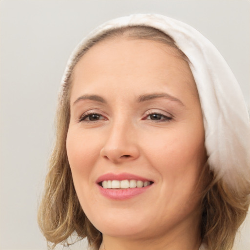 Joyful white young-adult female with medium  brown hair and brown eyes