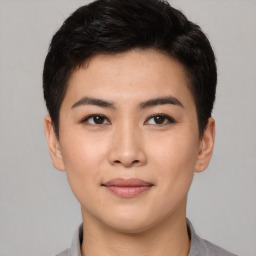 Joyful asian young-adult female with short  brown hair and brown eyes