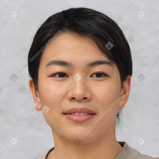 Joyful asian young-adult female with short  black hair and brown eyes