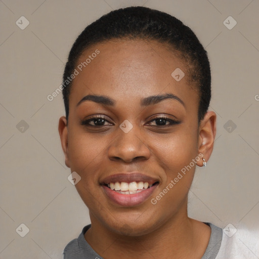 Joyful black young-adult female with short  black hair and brown eyes