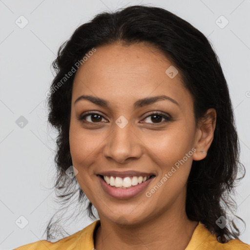 Joyful latino young-adult female with long  brown hair and brown eyes