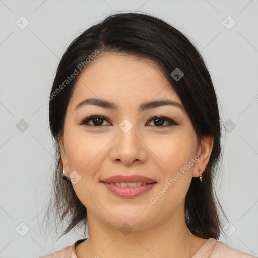 Joyful latino young-adult female with medium  brown hair and brown eyes