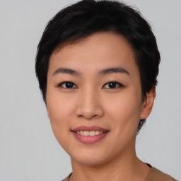 Joyful asian young-adult female with short  black hair and brown eyes