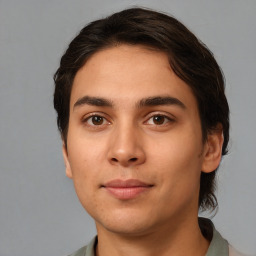 Joyful white young-adult male with medium  brown hair and brown eyes