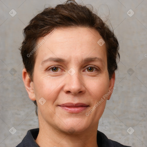 Joyful white adult female with short  brown hair and grey eyes