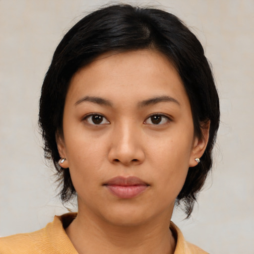 Neutral latino young-adult female with medium  brown hair and brown eyes