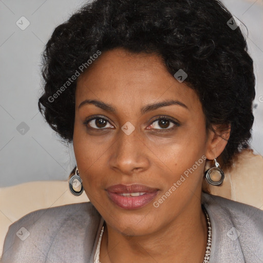 Joyful black adult female with short  brown hair and brown eyes