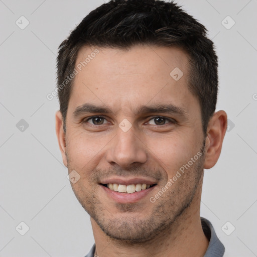 Joyful white young-adult male with short  brown hair and brown eyes