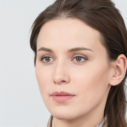 Neutral white young-adult female with long  brown hair and blue eyes