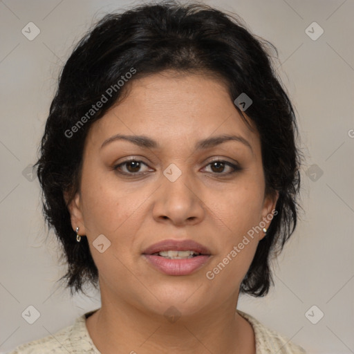 Joyful latino adult female with medium  brown hair and brown eyes