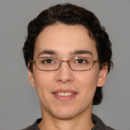 Joyful white young-adult male with medium  brown hair and brown eyes