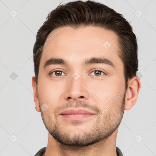 Joyful white young-adult male with short  brown hair and brown eyes