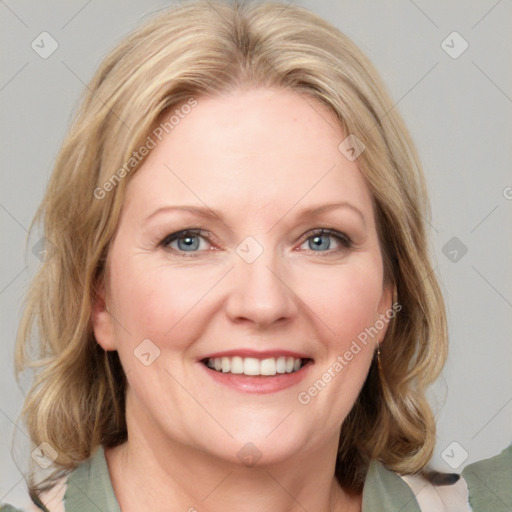 Joyful white adult female with medium  brown hair and blue eyes