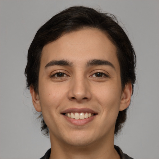 Joyful white young-adult male with medium  brown hair and brown eyes