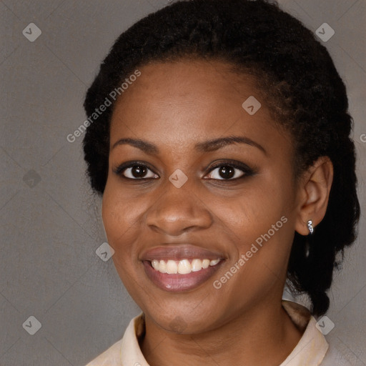 Joyful black young-adult female with medium  black hair and brown eyes