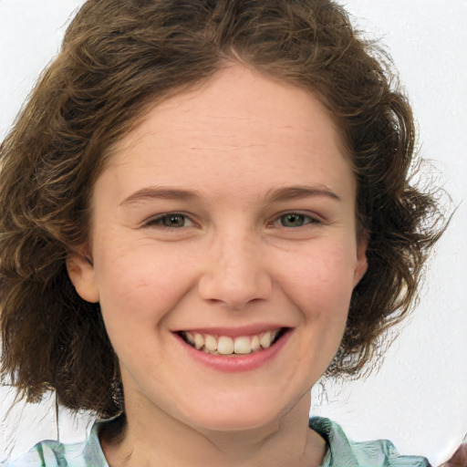 Joyful white young-adult female with medium  brown hair and green eyes