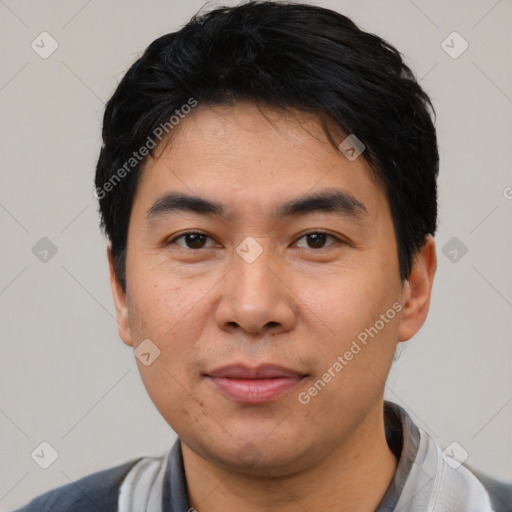 Joyful latino young-adult male with short  black hair and brown eyes