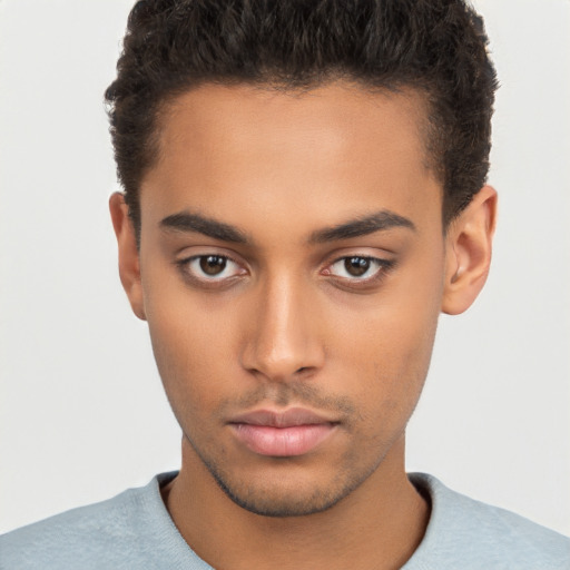 Neutral latino young-adult male with short  brown hair and brown eyes