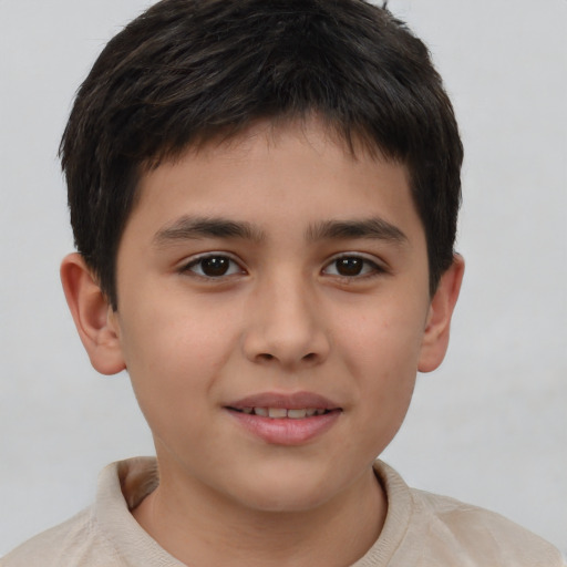 Joyful white child male with short  brown hair and brown eyes