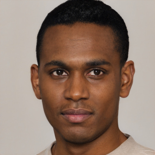 Neutral black young-adult male with short  black hair and brown eyes